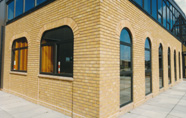 Corner of building with shaped aluminium windows